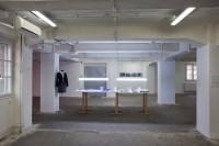 https://salonuldeproiecte.ro/files/gimgs/th-59_24_ Iulia Toma - From the blue coat to the flowery house coat, with a stop in corporate-augmented-reality, 2012 - installation, work table, mannequin, uniforms.jpg